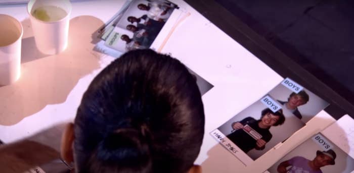 A view over Nicole&#x27;s shoulder of her pairing photos of Niall and Harry