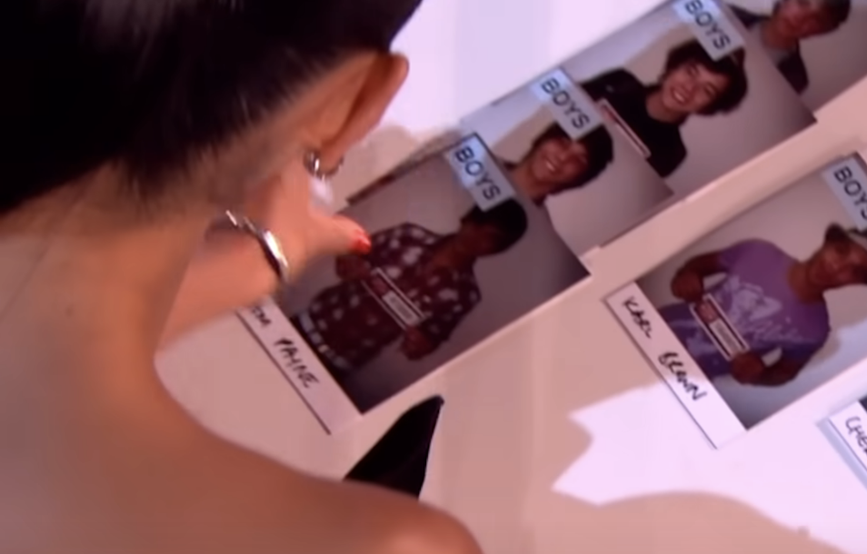 Nicole placing Liam&#x27;s photo beneath the previous three