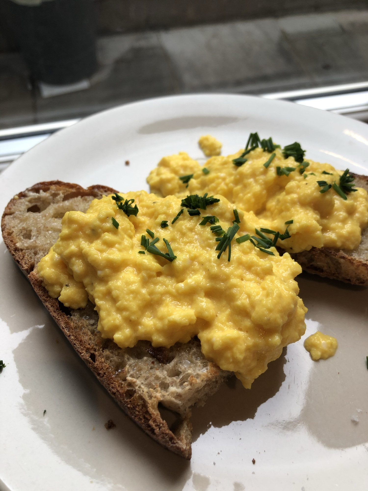 Loose scrambled eggs on toast.