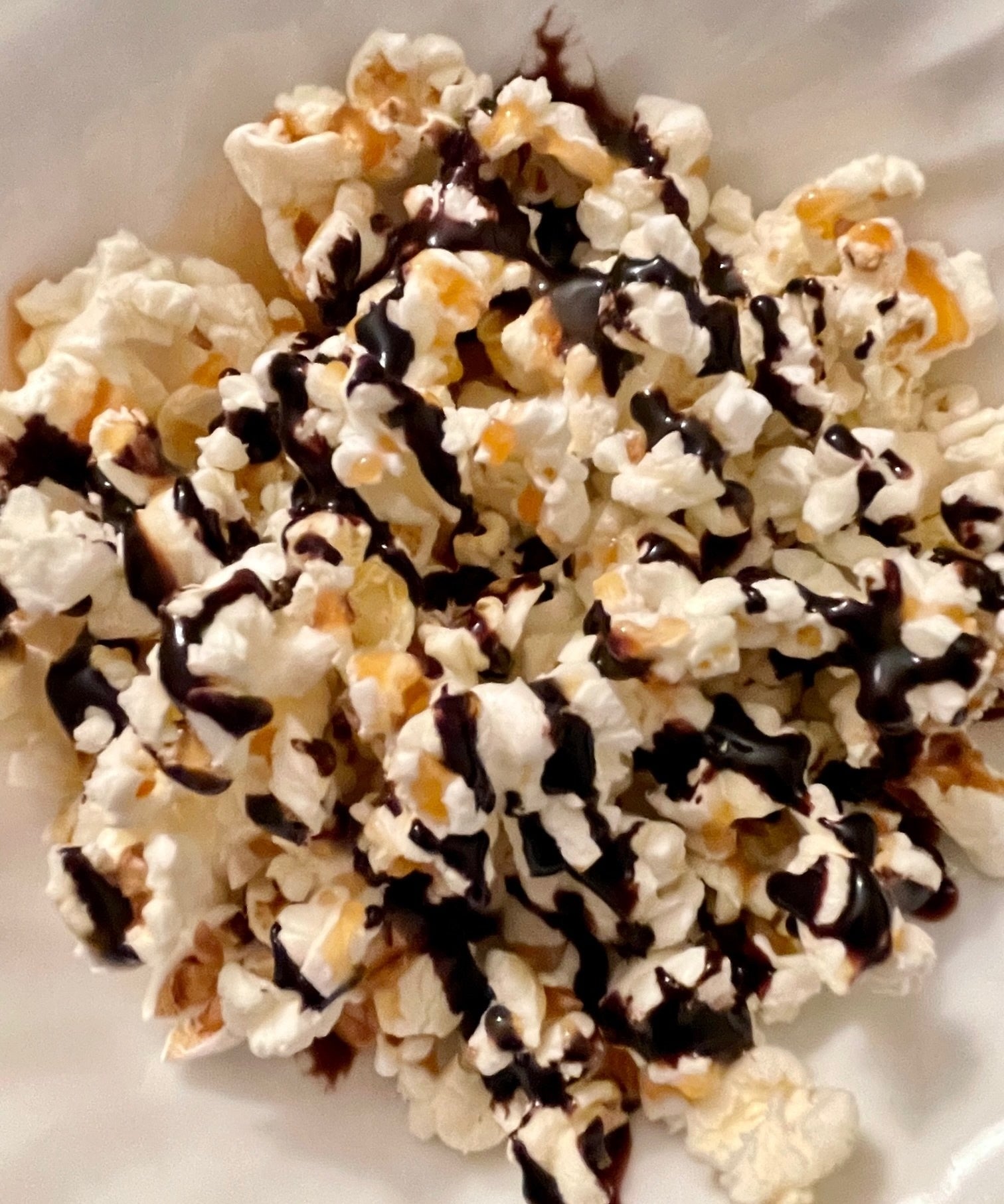 Popcorn with chocolate and caramel syrup