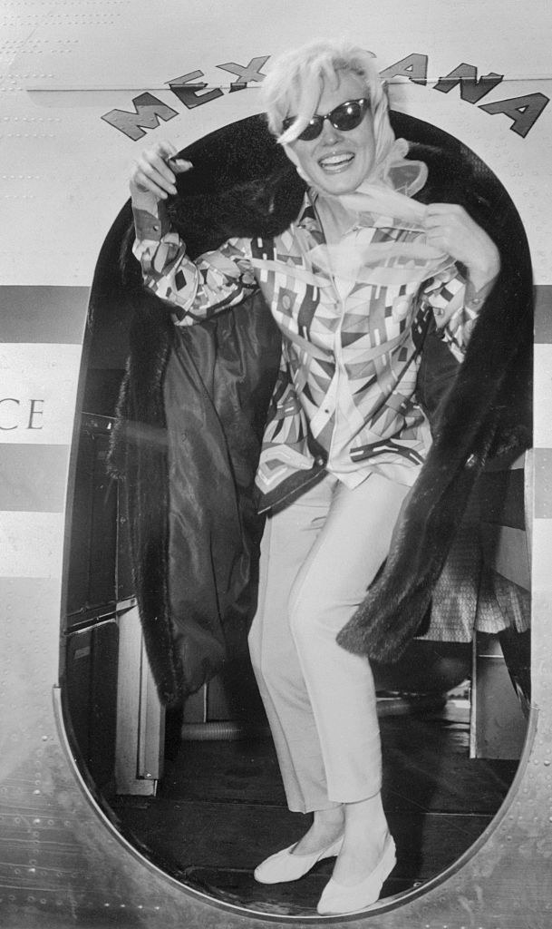 Marilyn Monroe exiting a plane