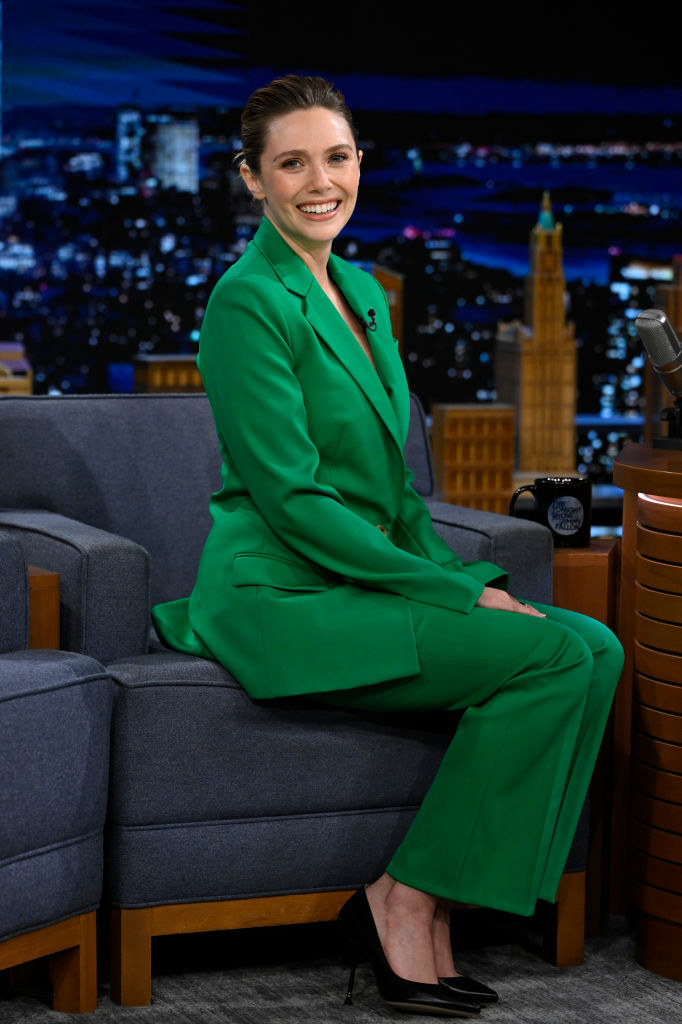 Elizabeth Olsen smiling on a talk show
