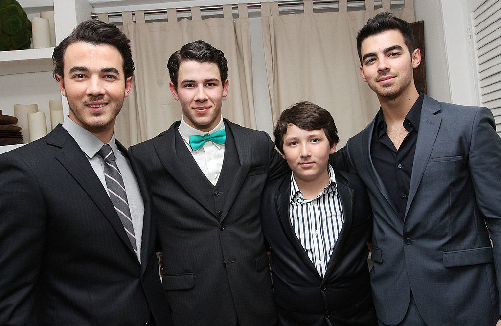 the Jonas Brothers with their little brother