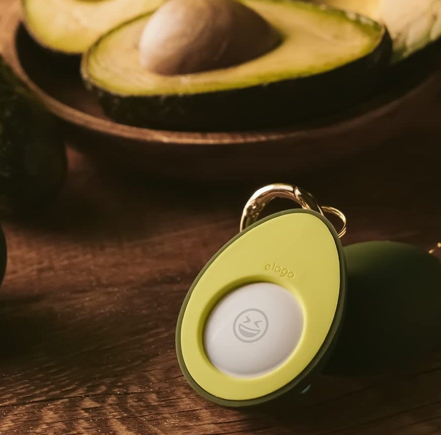 The Keyring with an AirTag in it on a wooden table