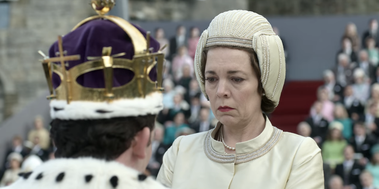 Olivia Colman wearing a similar hat and dress for the recreation of the moment