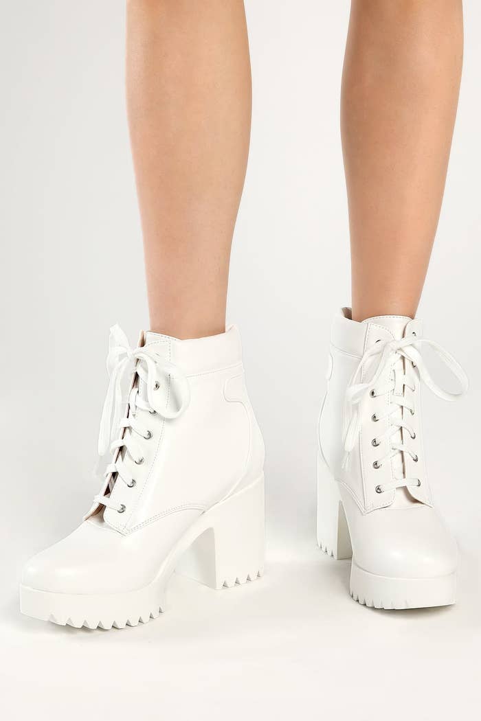 Model wearing white boots
