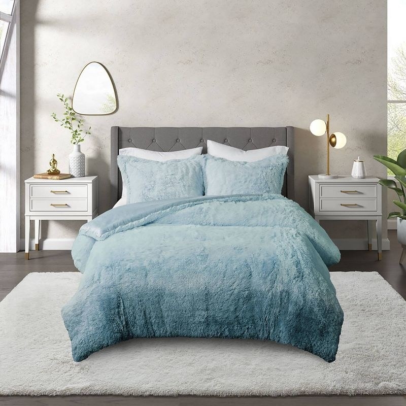 the comforter in a blue gradient