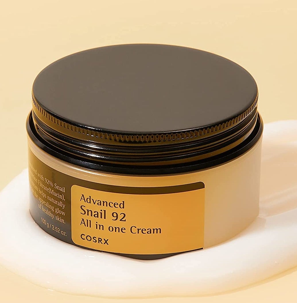 A jar of the moisturizer on top of the cream