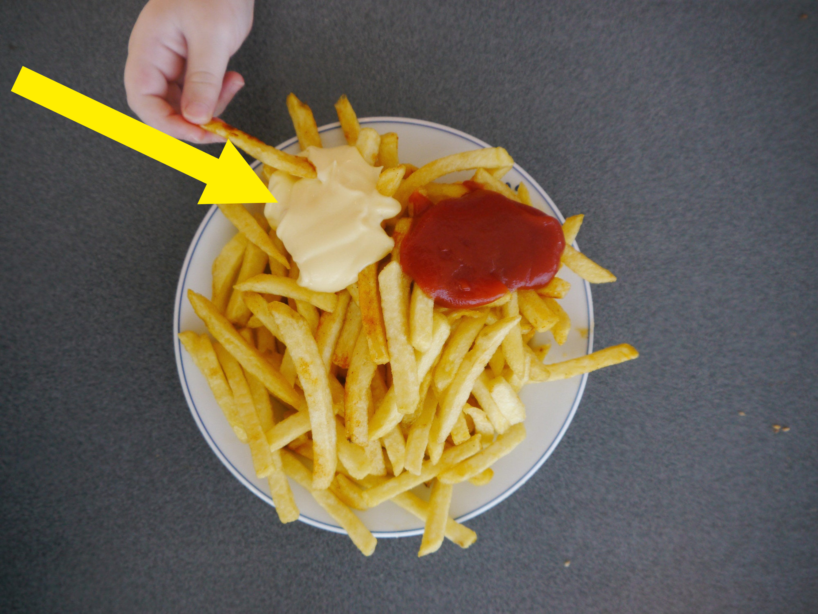 French Fries with mayonnaise and ketchup.
