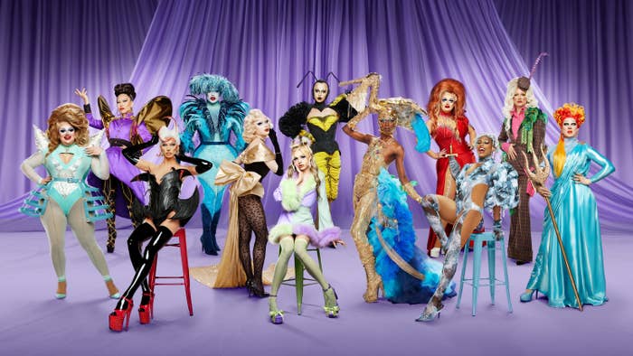 drag queens pose in a big group