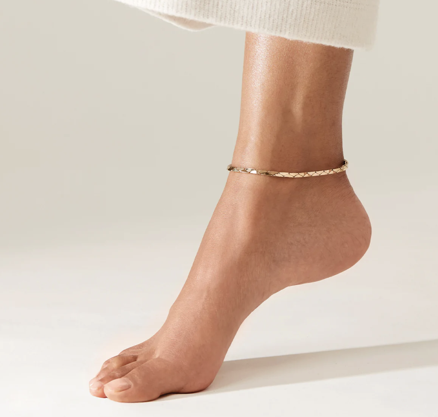 A person wearing the anklet