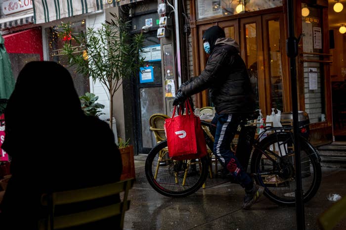 a person riding a bike delivering food