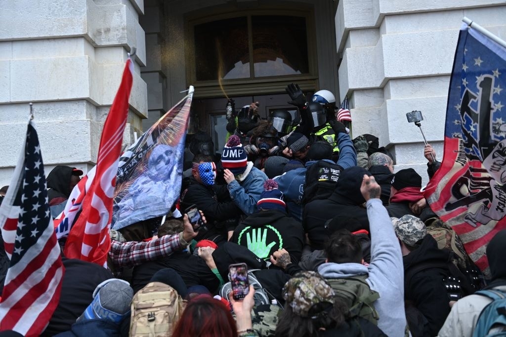 trump supporters clash with police and security forces as they storm the US Capitol