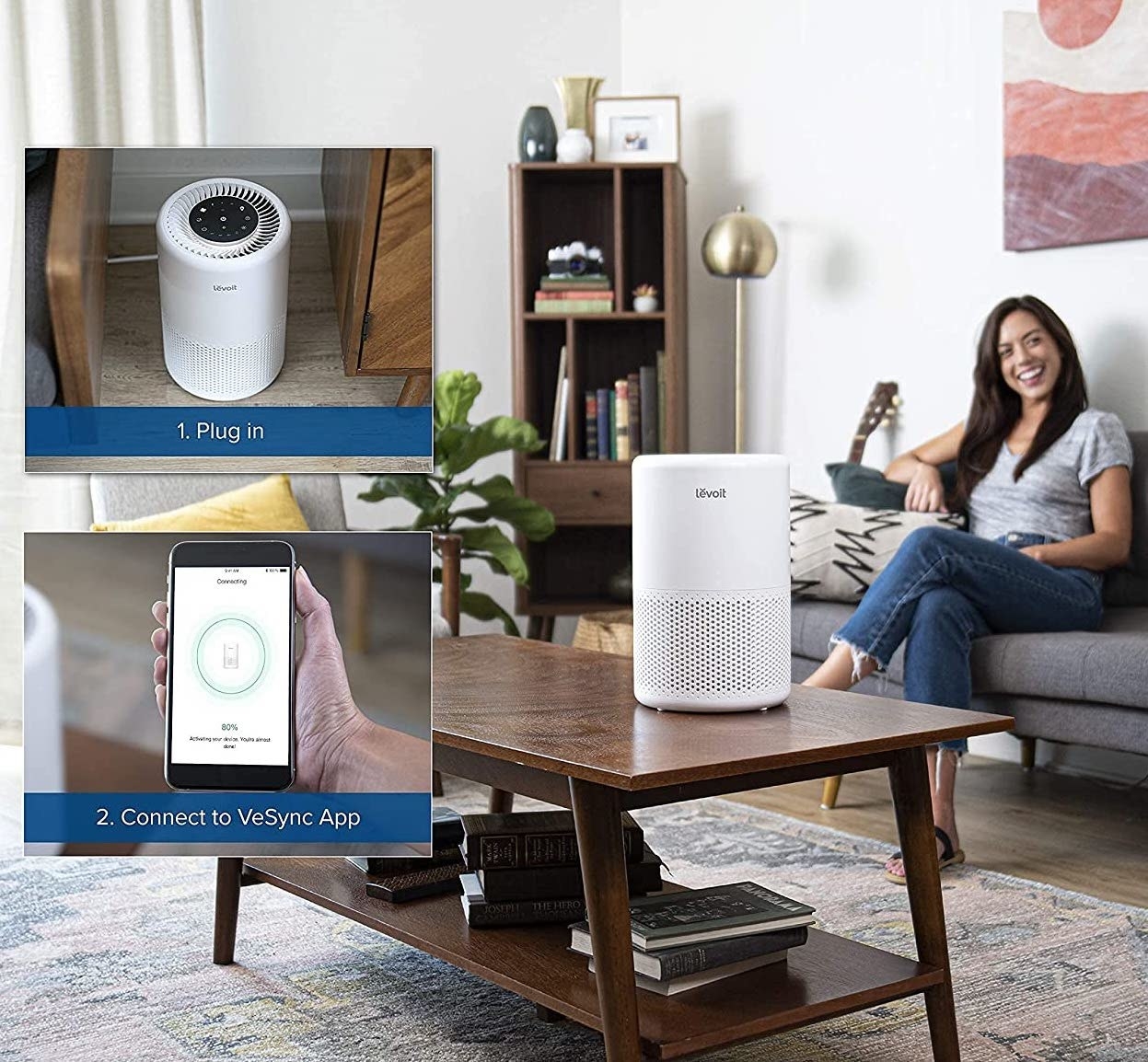 The air purifier on a table in front of a person sitting on a couch