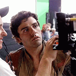 Oscar Isaac watching the monitor on the set of The Force Awakens