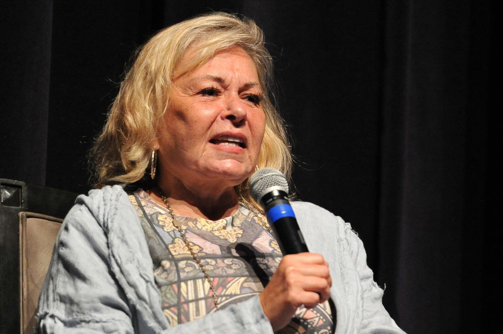 Roseanne speaking into a microphone