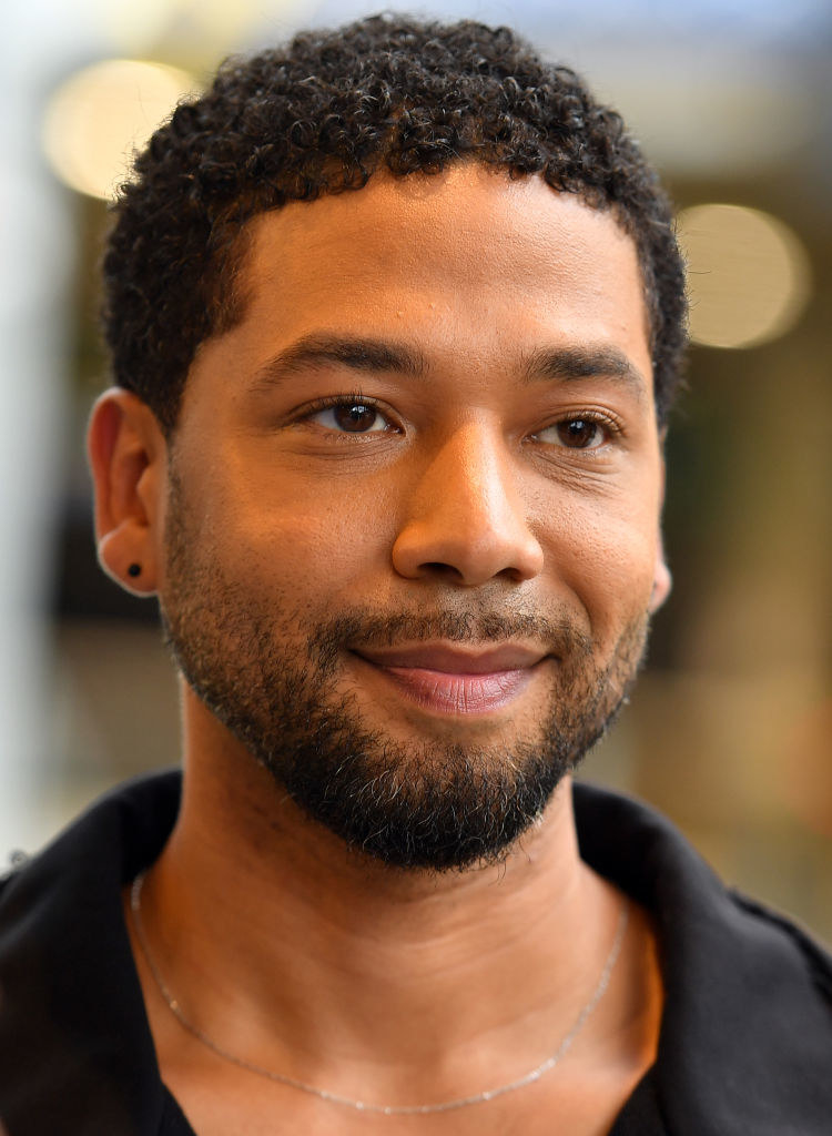 Close-up of Jussie smiling slightly