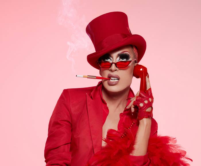 Alaska 5000 smoking a cigarette and holding up an old phone to her ear