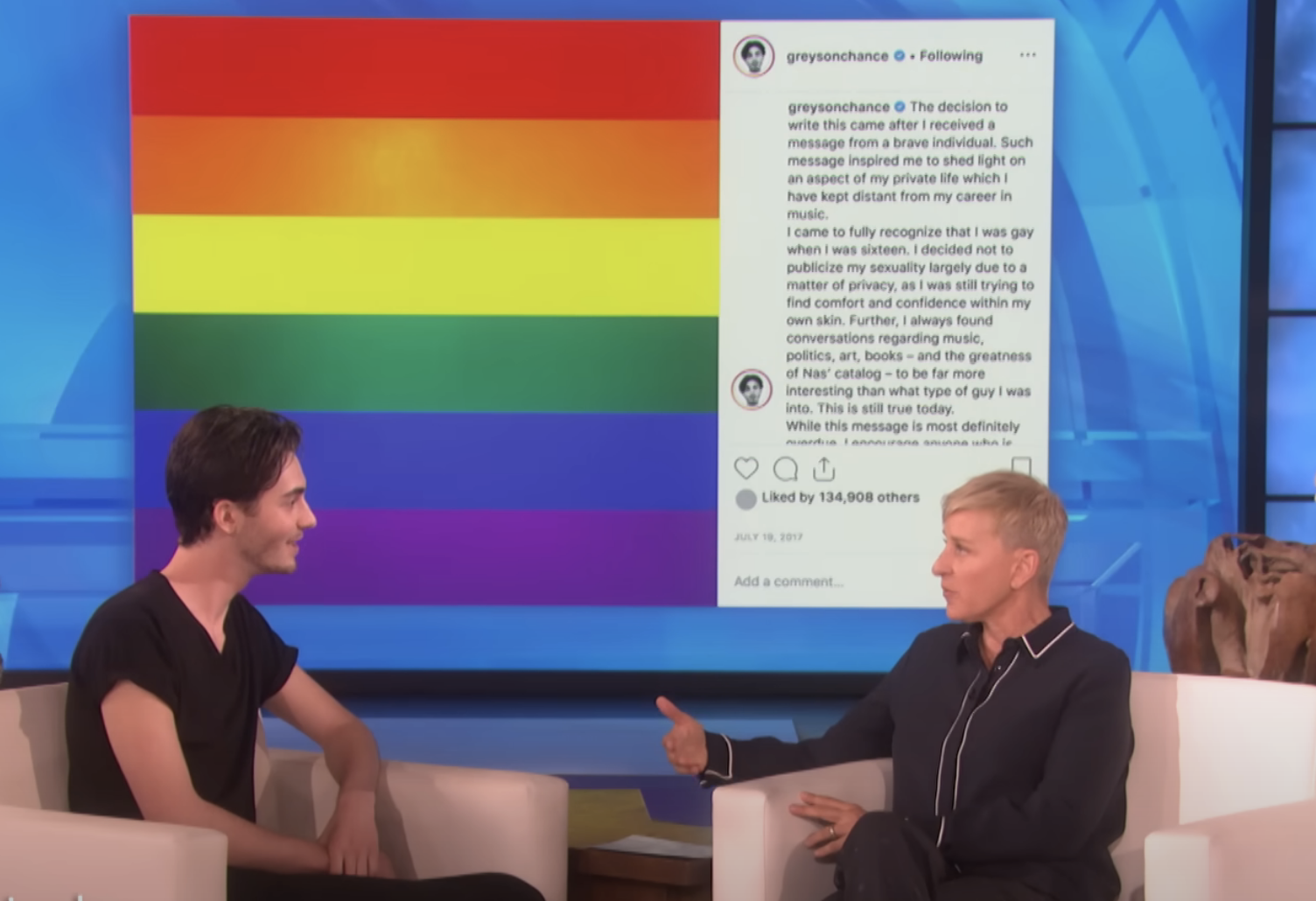 Greyson and Ellen talking on her show with his Instagram post and rainbow colors on a screen in the background