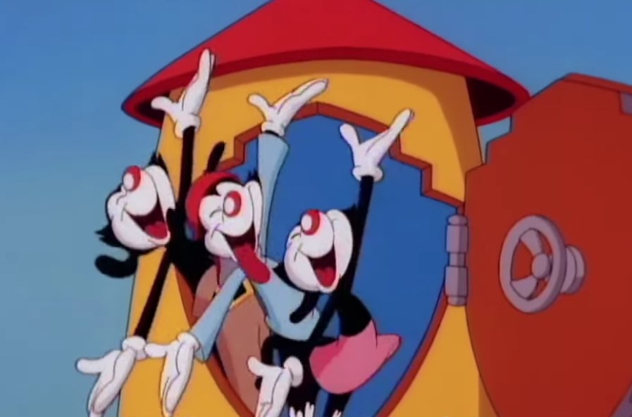 The Animaniacs smile and gesture in the doorway to their water tower