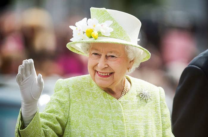 Queen Elizabeth II smiling and waving
