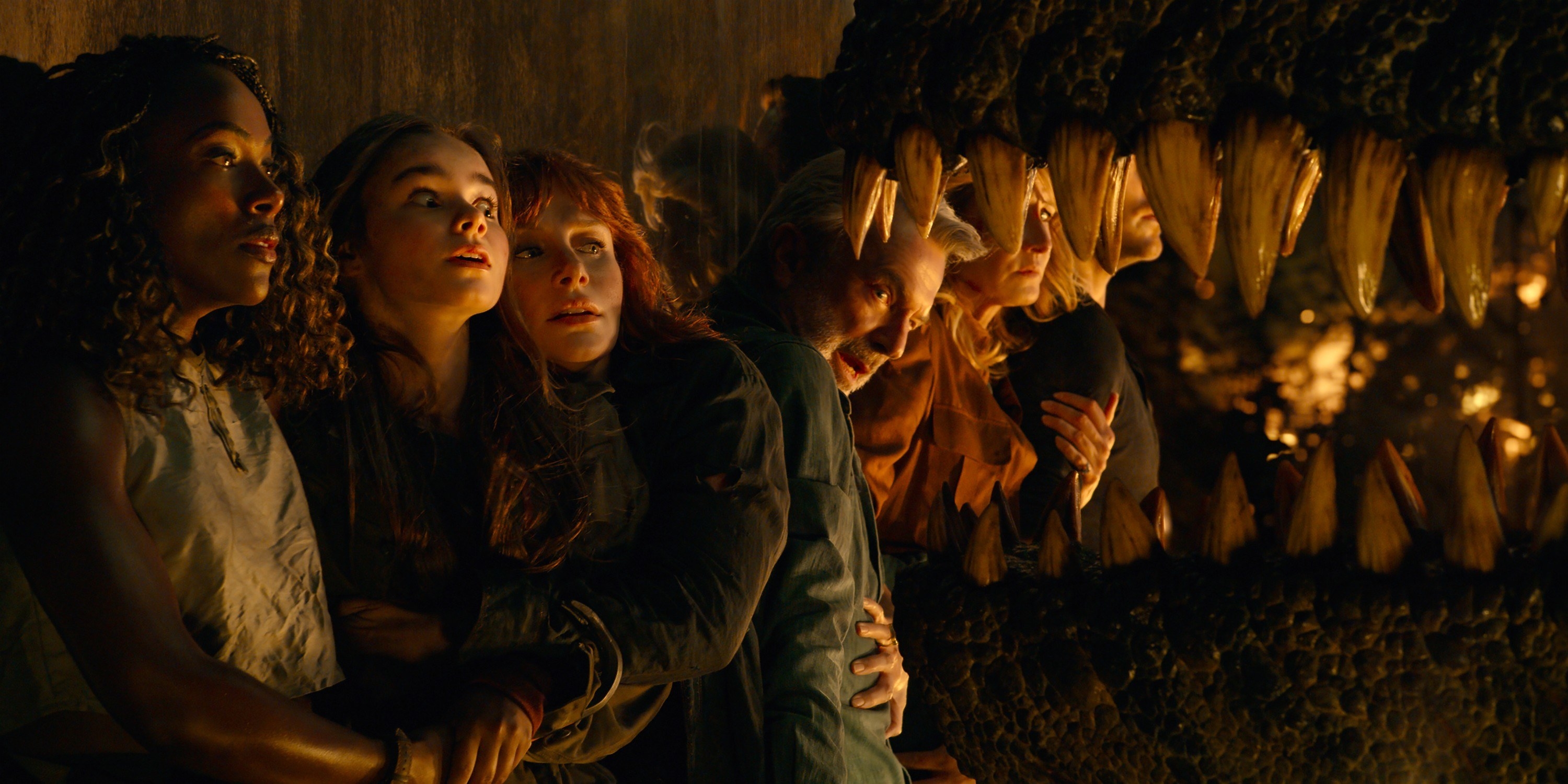 Three women in the film hugging each other in fear