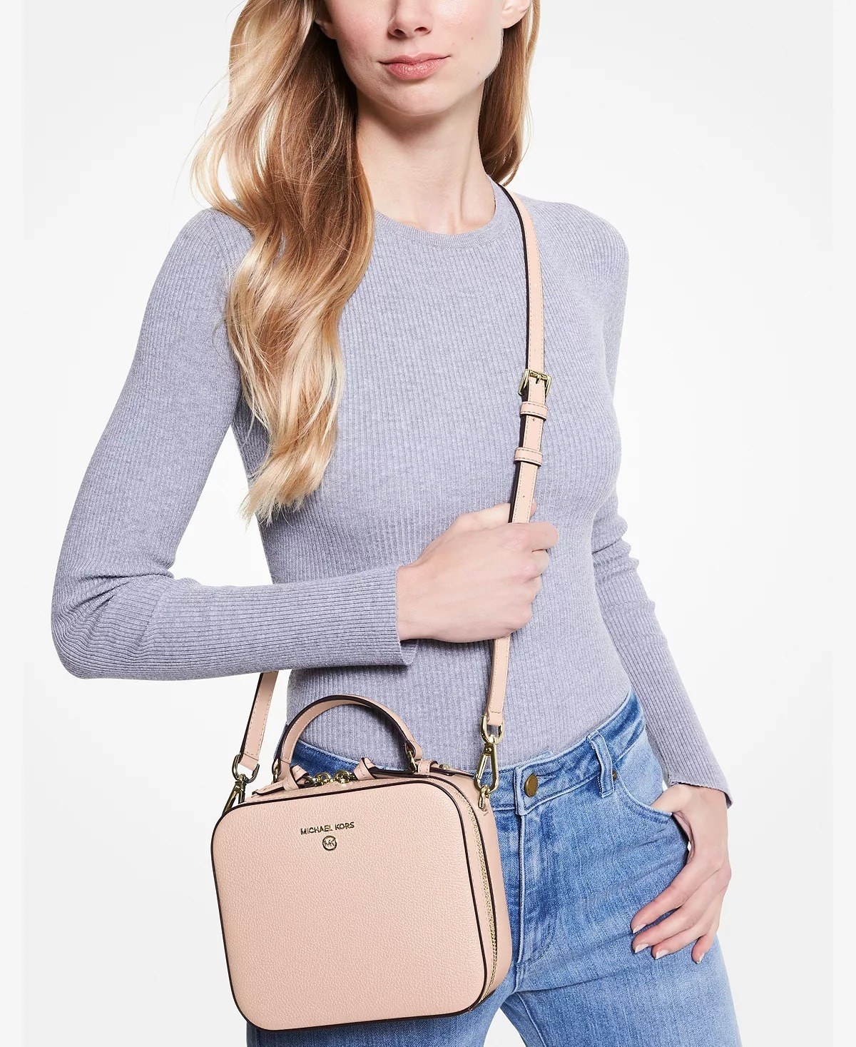model wearing pink small crossbody bag