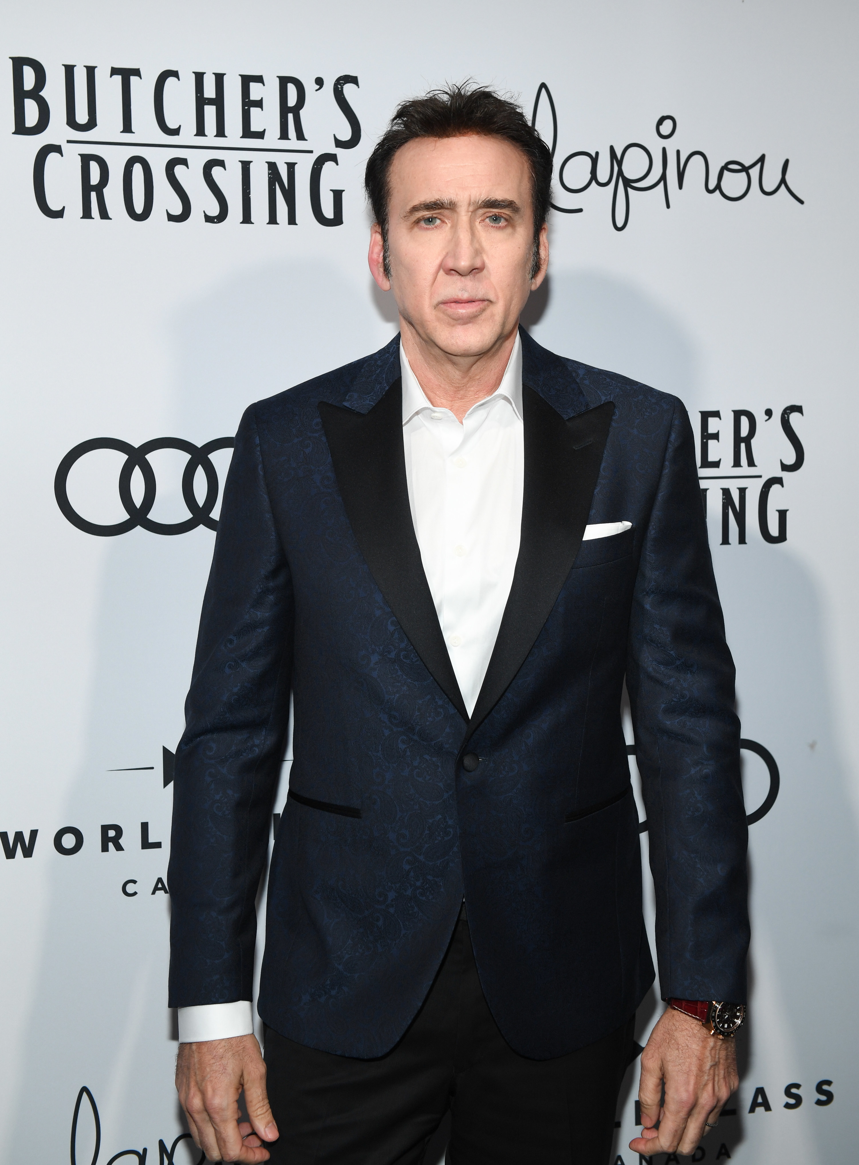 Cage looking serious at an event