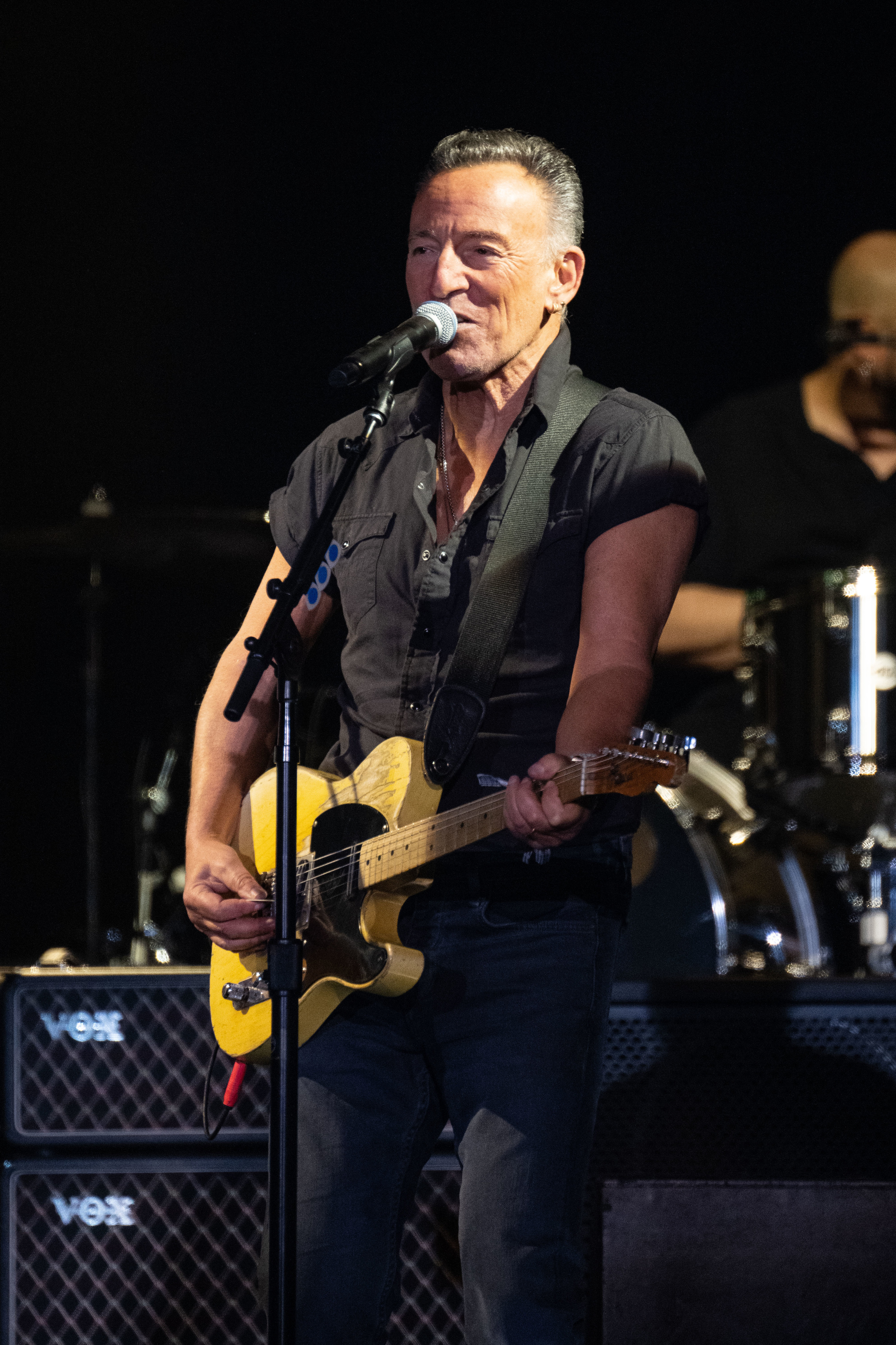 Springsteen playing guitar and singing onstage