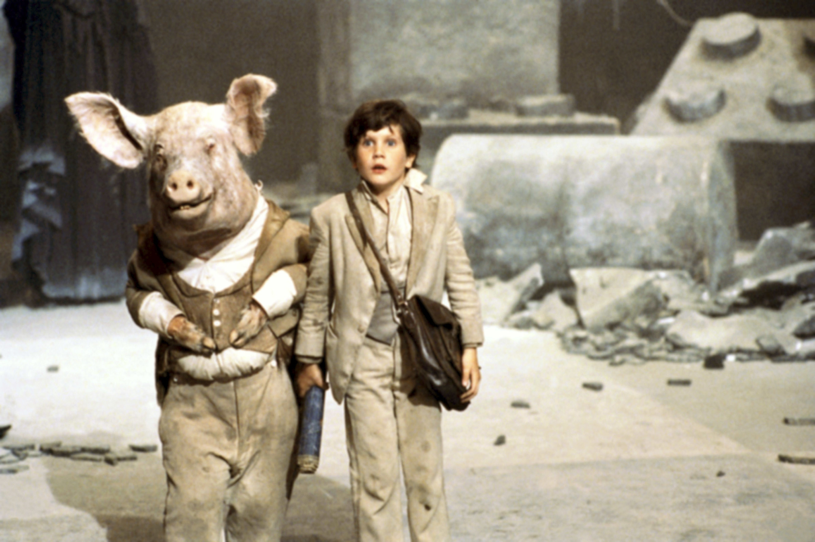 Craig Warnock walking next to someone with a pig&#x27;s head.