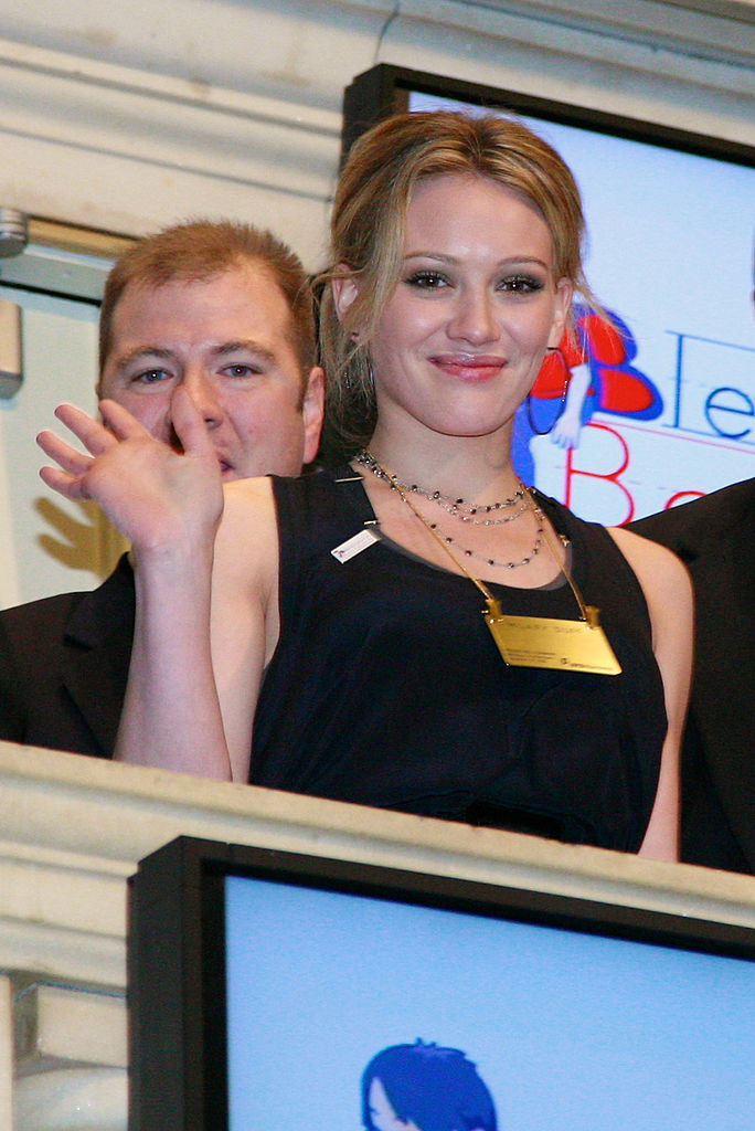 Hilary waving