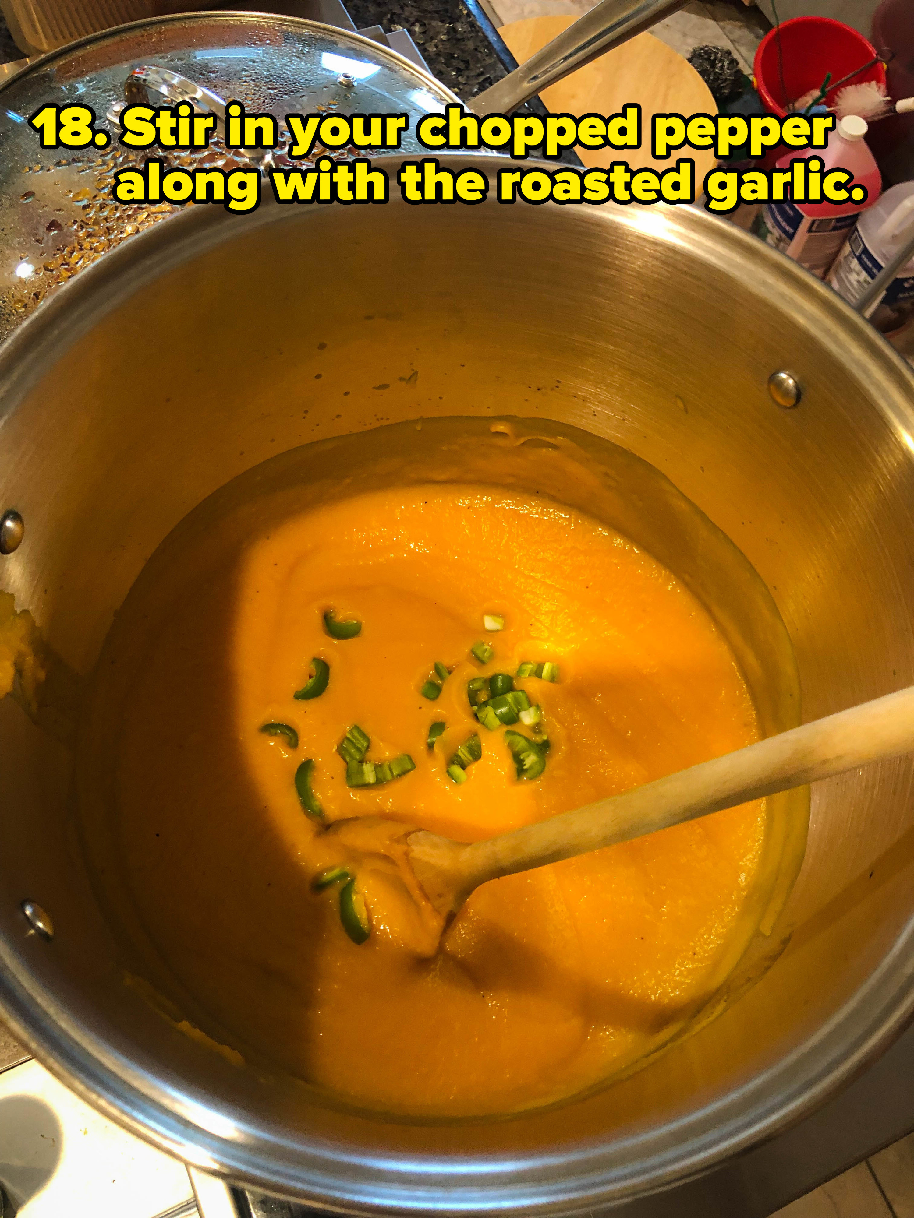stirring soup in a pot