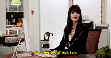 Gif of Anne Hathaway in &quot;The Devil Wears Prada&quot; saying &quot;The Chanel boots? Yeah, I am.&quot;