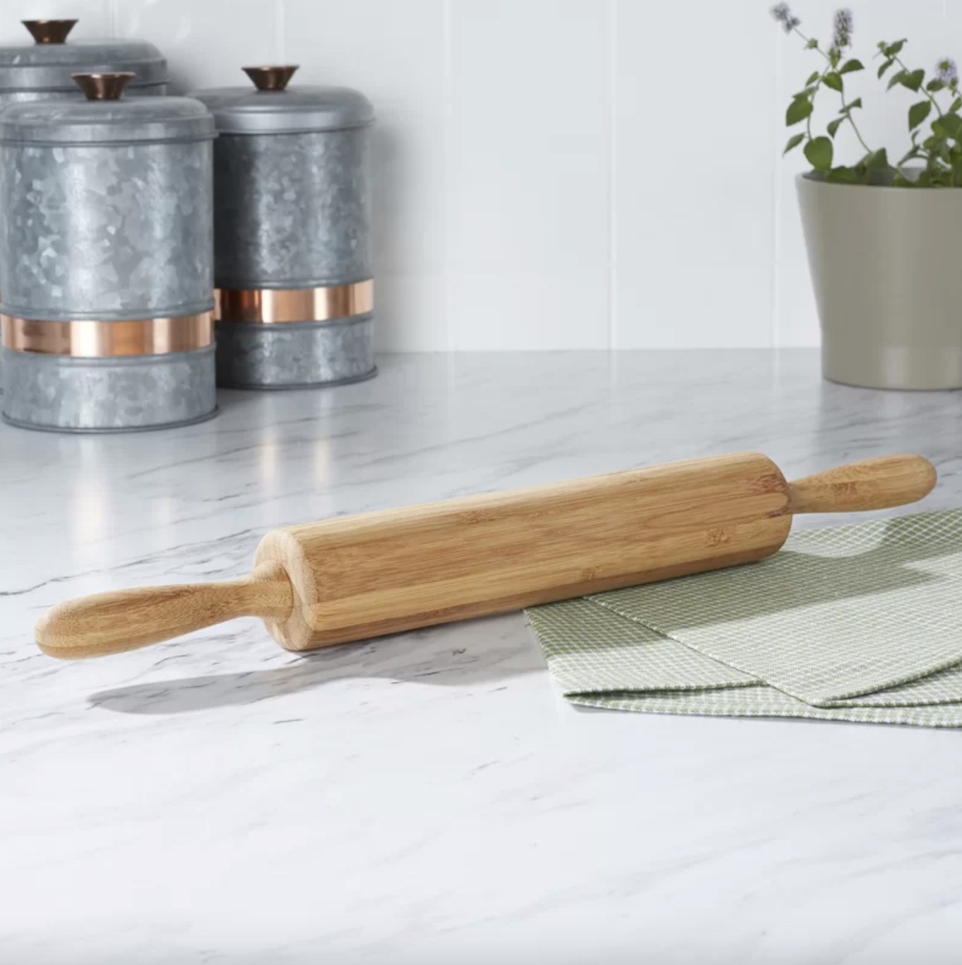 the wooden rolling pin on a decorated counter