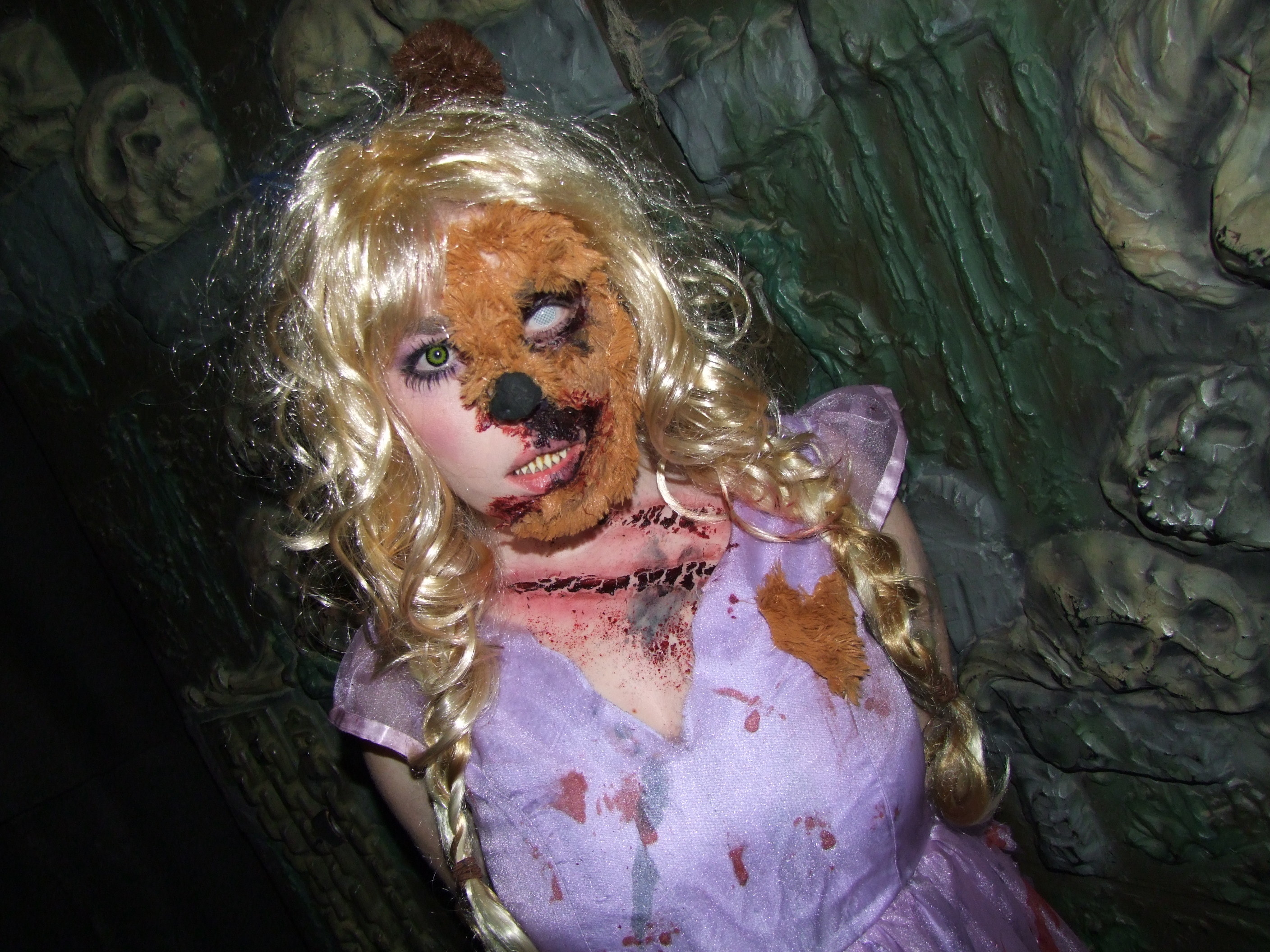 A woman with her face spliced into a teddy bear approaches guests at &quot;Spookers&quot;