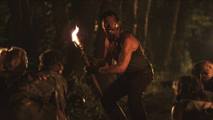 A torch-wielding man attempts to repel a pack of vampires in &quot;Stake Land&quot;