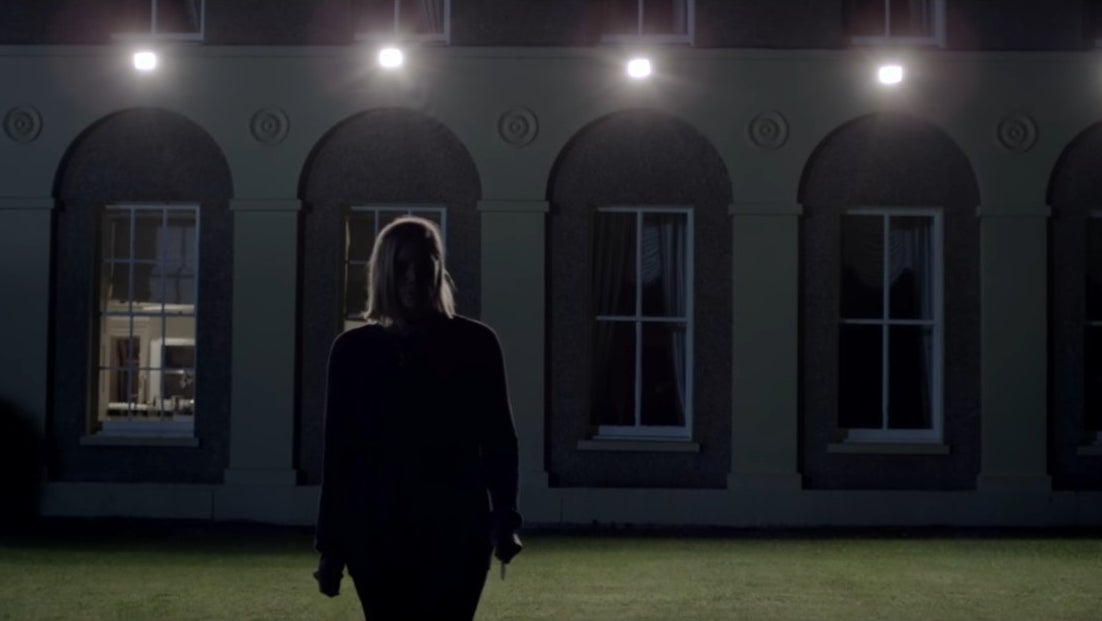 A woman attempts to search for someone on her lawn at night in &quot;Don&#x27;t Knock Twice&quot;