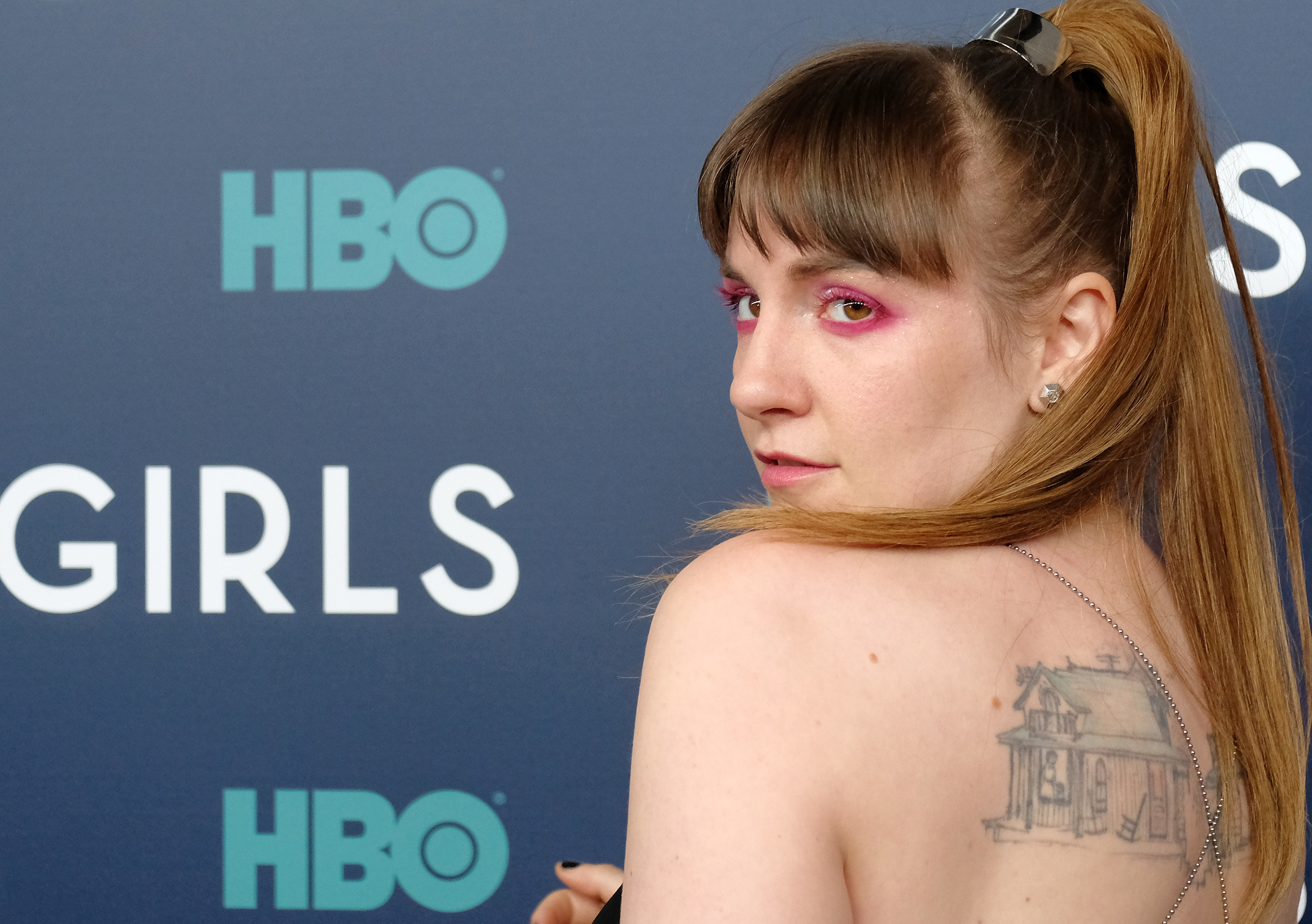 Lena Dunham looking over her shoulder