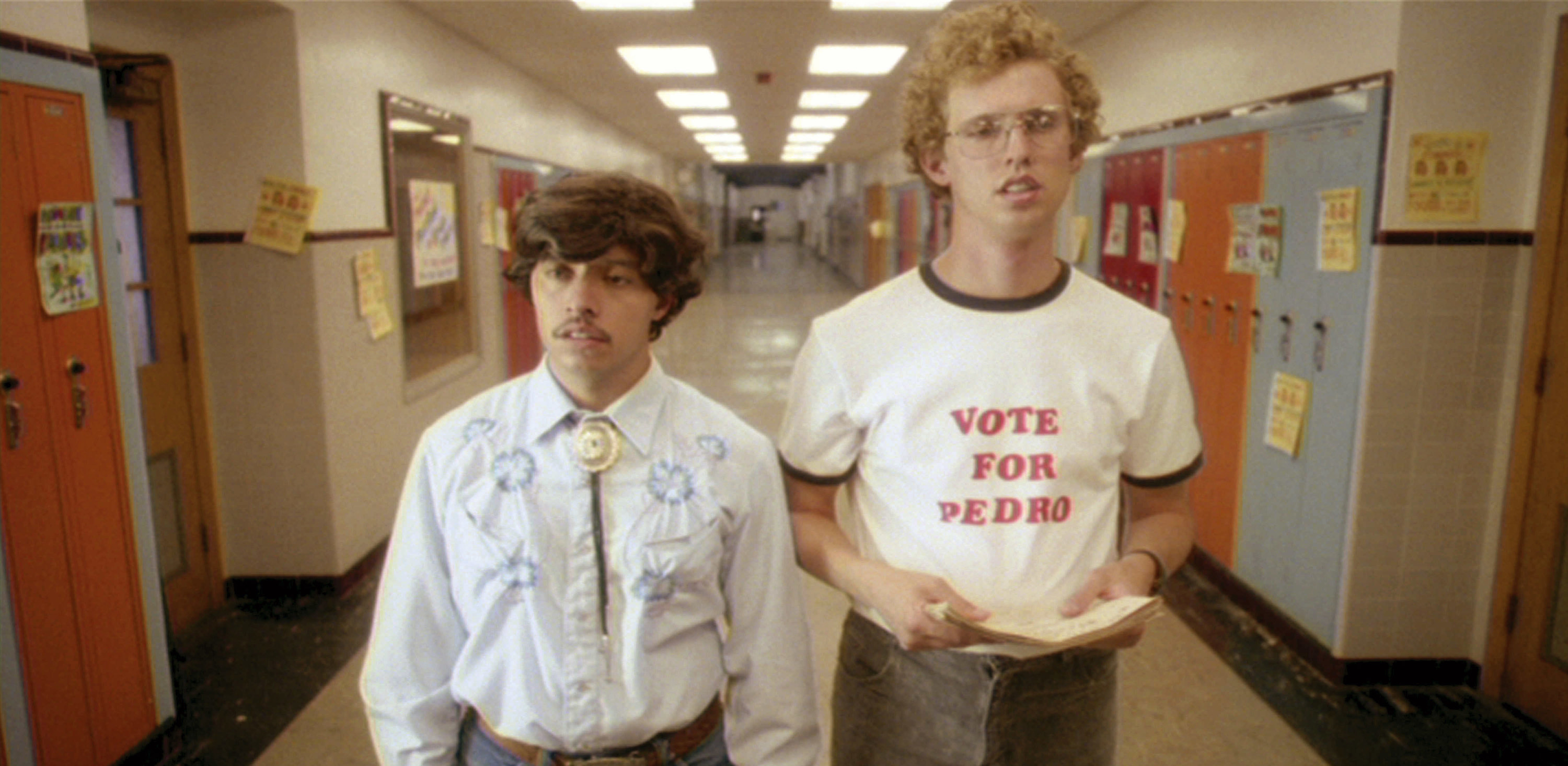 Two students stand in a hallway, one wearing a &#x27;Vote for Pedro&quot; shirt