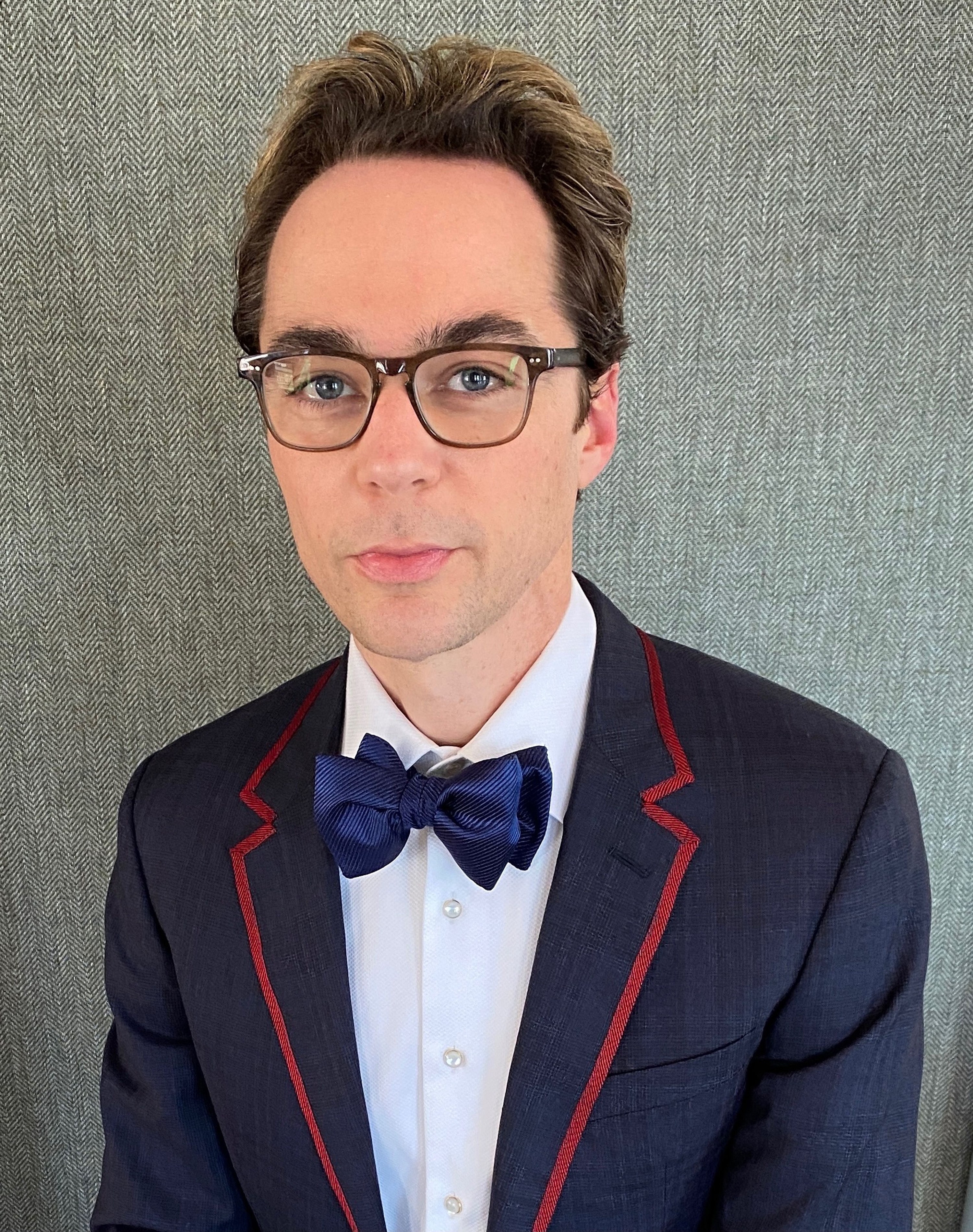 Jim wearing glasses and a bow tie