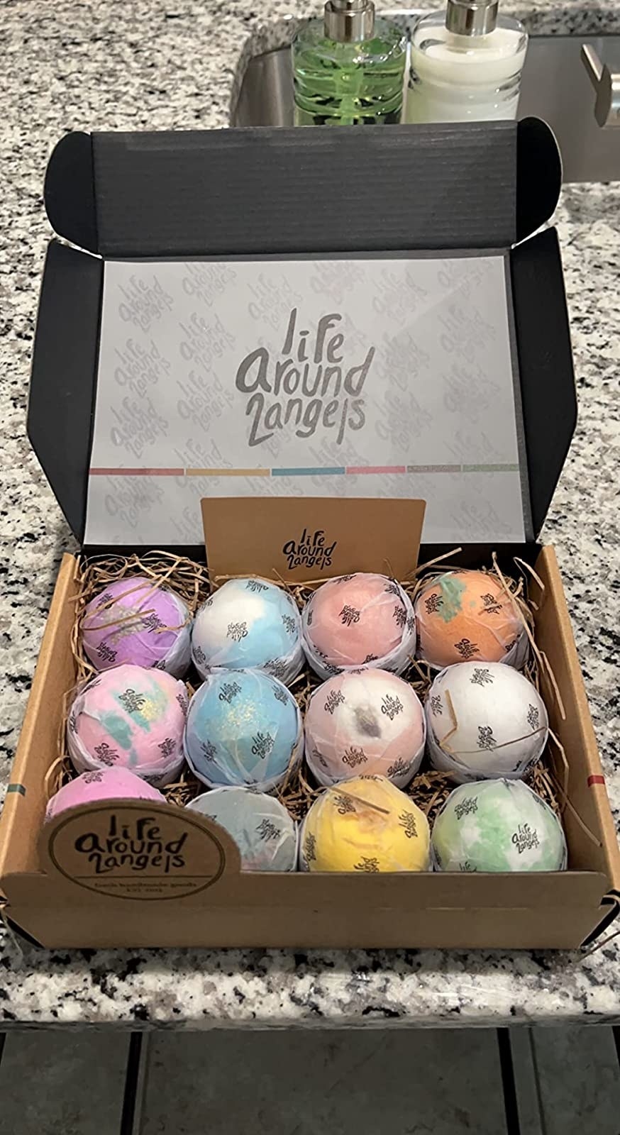 Reviewer image of wrapped bath bombs in a box