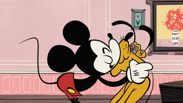 mickey mouse rubbing his face with his dog