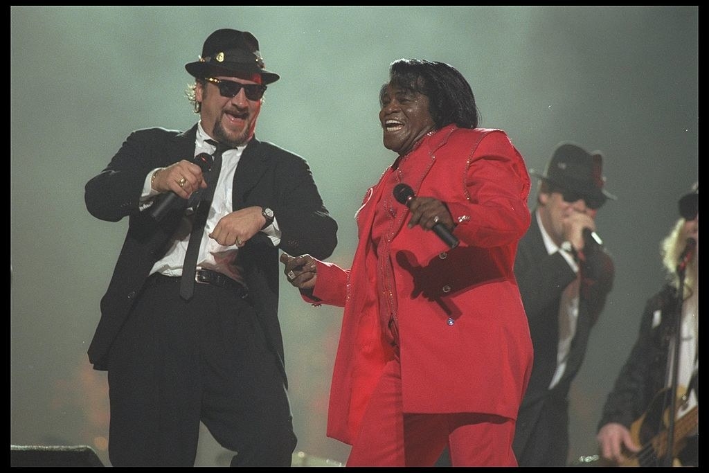 Jim Belushi and Dan Aykroyd performing with James