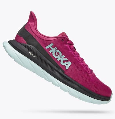 Hoka running shoes with pink upper area and black and blue colors on the bottom