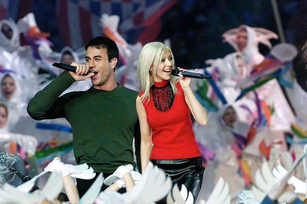 Enrique and Christina performing