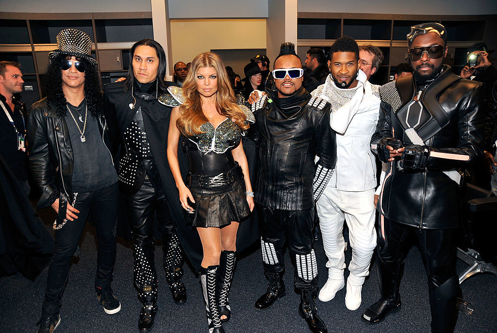 Slash and Usher posing with the Black Eyed Peas