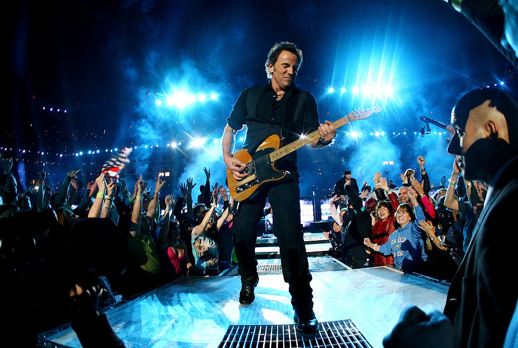 Bruce onstage in the middle of the crowd