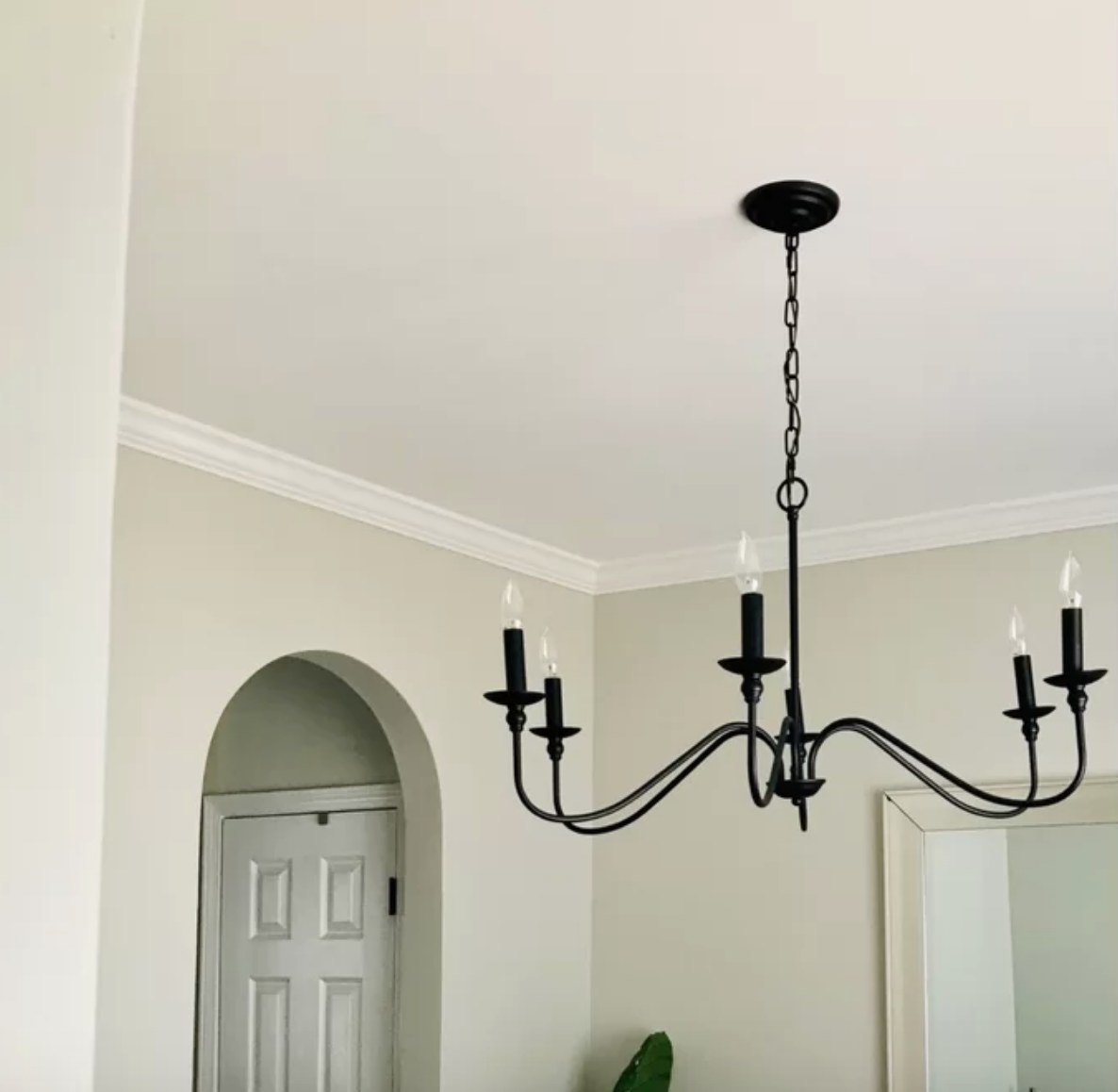 Black chandelier hanging from ceiling