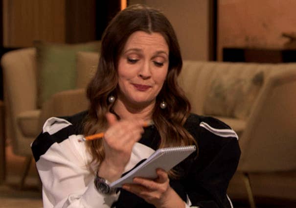 Drew Barrymore writing in a notepad