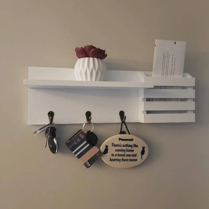 a reviewer photo of the white mail organizer